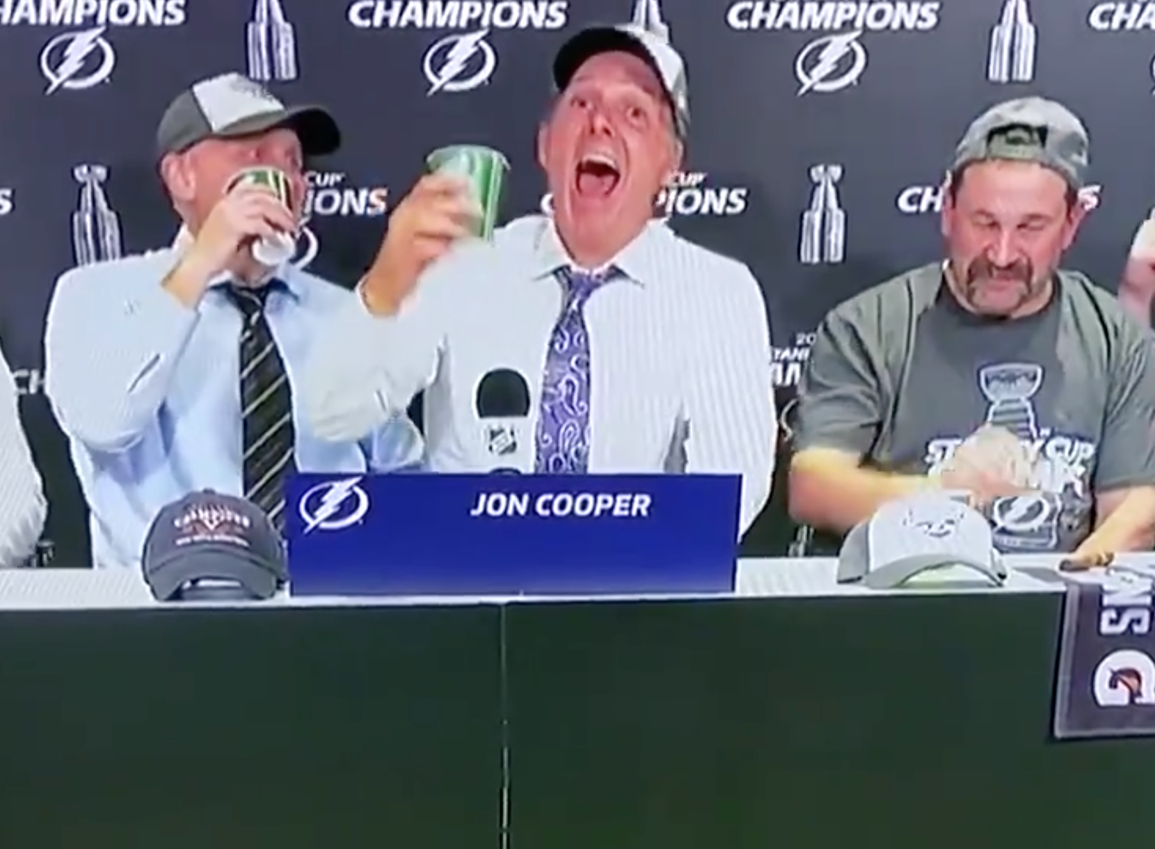Cooper laughs it up with former Lightning player Callahan during interview