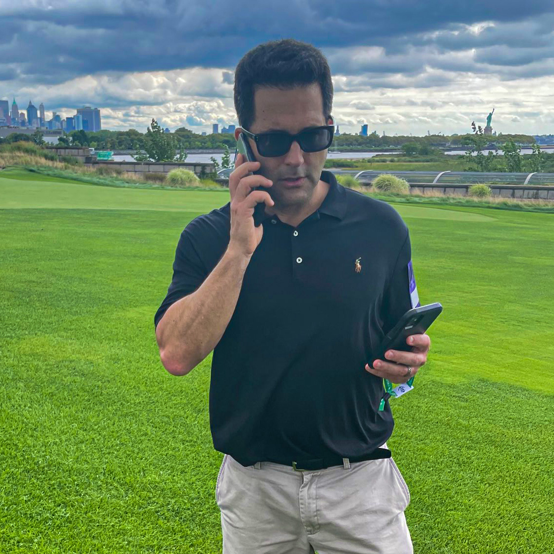 Adam Schefter spotted at Liberty National (rocking dual cell